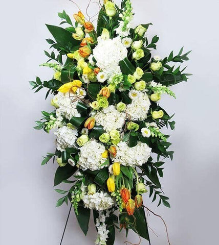 Brighter Blessings™ Standing Spray - hydrangeas, parrot tulips, green roses, asters and snapdragons and designed with twigs and lush greens
