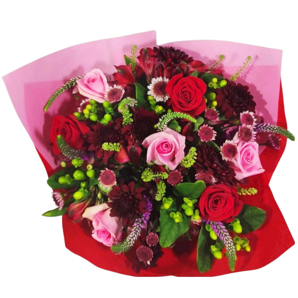 Flirt and Fun from Flower Co. is the bouquet of love! With red, burgundy and pink flowers, you will make the day of that person you love. Send fresh, long-lasting flowers.