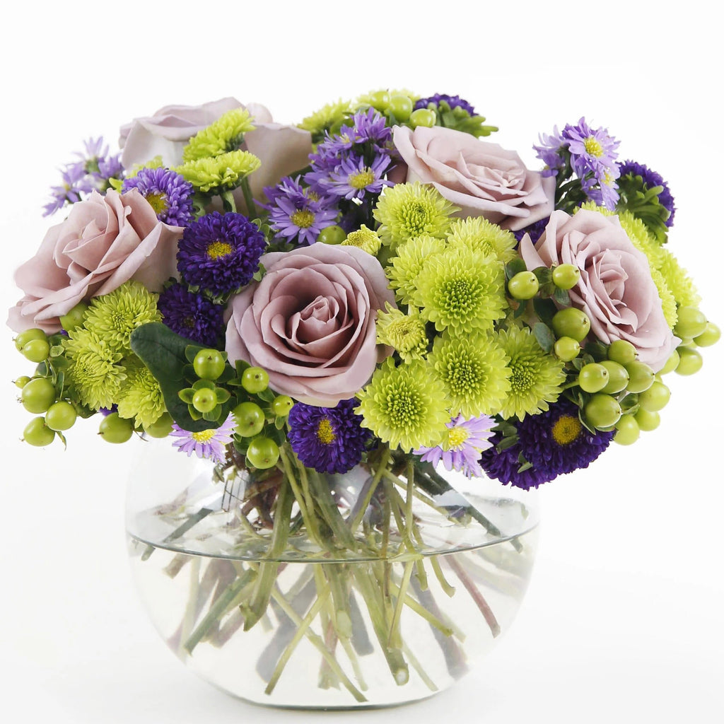A Splendid Day™ Bouquet - lavender roses , lavender monte casino asters , purple matsumoto asters , green hypericum berries , green button poms , vase arrangement