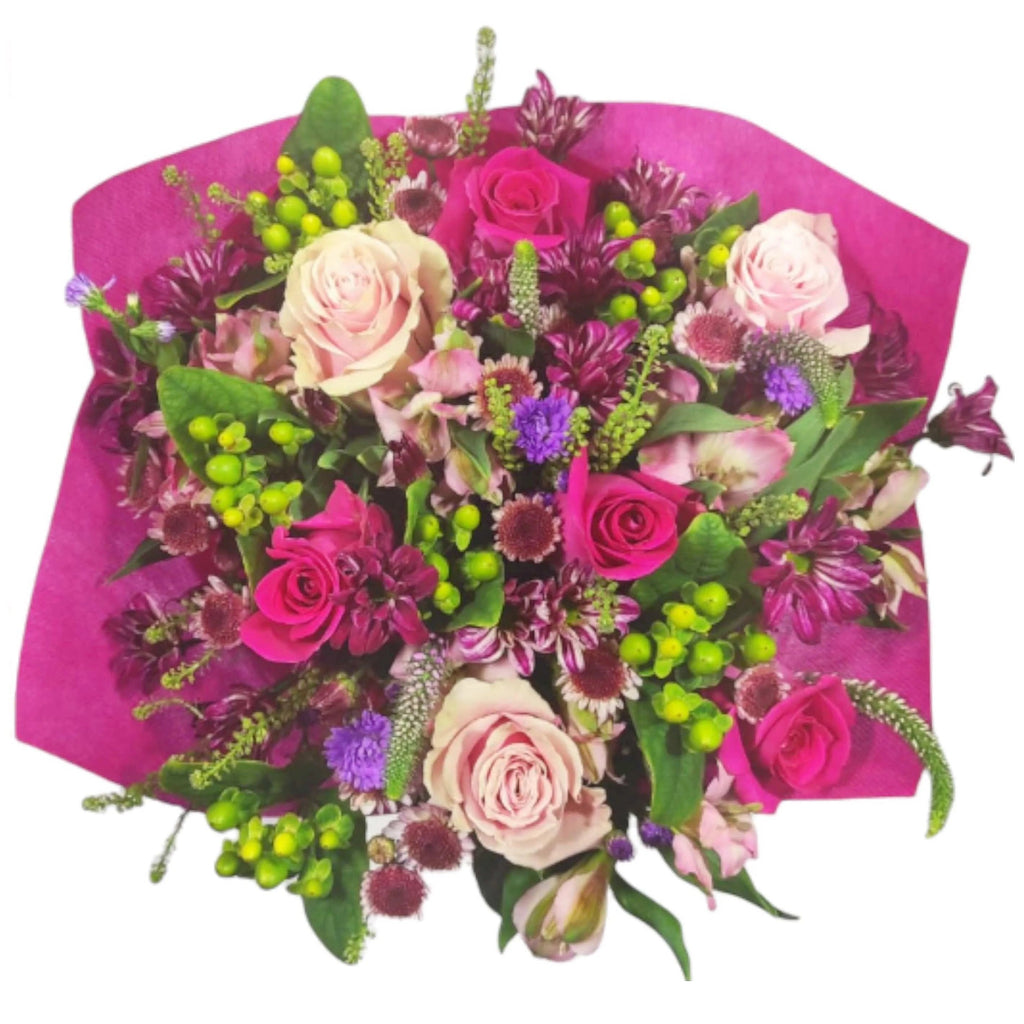 Flower Co.'s Beautiful Mom Bouquet is a sweet design comprised of hot and light pink roses, green hypericum, purple chrysanthemums and veronicas, accented by premium fillers and foliage.