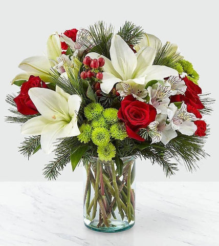 Christmas Spirit™ Bouquet - white lilies, pine, evergreens, alstroemeria, green button mums, kermit daisies, christmas flowers