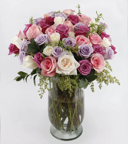 In Bloom Divine - purple roses , pink roses , cream roses , off-white roses , vase arrangement