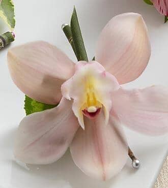 cymbidium-orchid-boutonniere - pink orchid , cyclamen leaf , eqiusetum , boutonniere , wedding , prom , graduation