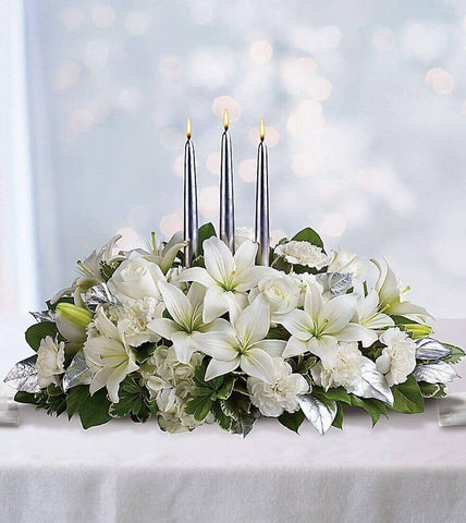 Silver Elegance Centerpiece - white hydrangea , white lilies , white carnations , salal , variegated pittosporum , silver leaves , candles , centrepiece